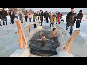 Baptism of Jesus (Epiphany day), orthodox christans dip into Icy holy water - Tver city, Russia