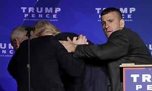 BREAKING NEWS: Watch as Donald J. Trump is rushed off stage by Secret Service agents at his rally in Nevada. There have been unconfirmed reports of a man with a gun in the crowd. | Guardian Australia