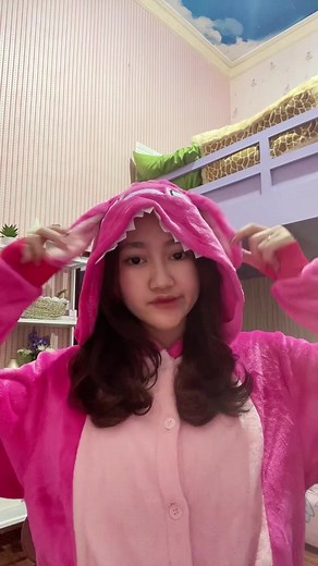 Adorable Shark Onesie Fun in a Playful Room