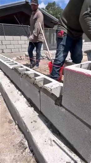 Installation process. Hollow concrete blocks are neatly installed on reinforced steel #construction