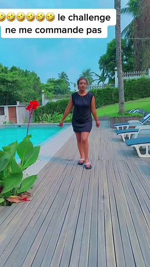 Playful Poolside Challenge in a Black Dress