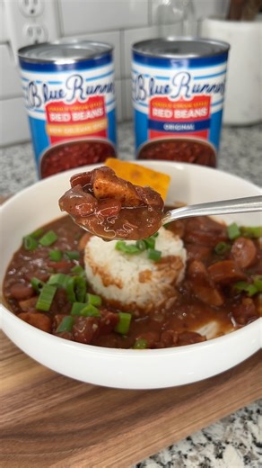 Kristie on Instagram: "Blue Runner Red Beans Ingredients 🫘1/2 Diced yellow onion 🫘1/2 Diced green bell pepper 🫘Minced garlic 🫘1 Can @bluerunnerfoods Red Beans (Original) 🫘1 Can @bluerunnerfoods Red Beans (Spicy) 🫘 2 (14oz) Smoked sausage diced 🫘Cajun seasoning to taste 🫘Hot sauce to taste *Best served over rice and garnished with green onions* #recipe #redbean #yum #dinner #cajuncooking #bluerunner #bluerunnerpartner #food #cooking"
