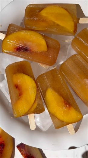Weekend and Labor Day plans: making these 2-ingredients Peach Sweet Tea Popsicles! These pops are as easy as it gets. They’re a great treat for the holiday weekend and use up the last of those farmers market peaches! | Country Living Magazine