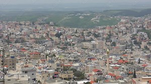 Skyline of Umm El Fahm, an Arab town with citizens of Israel. Umm al-Fahm is the social, cultural and economic center for residents of the Wadi Ara and Triangle regions.