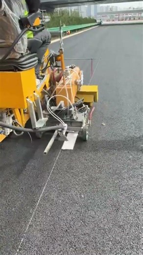 Thermoplastic extrusion marking machine.