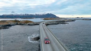 This drone footage shows the beauty of Norway's Atlantic Ocean Road, also known as Atlanterhavsveien. This stunning footage captures the iconic winding road and its unique bridges connecting islands a