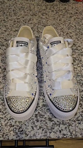 Ms Ramsay, CEO on Instagram: "**FOR SALE** Are you a 2026 bride? Look no further for your reception sneakers! No one wants to go barefoot or wear uncomfortable flip flops when you can get a pair of custom bling bridal converse! I can add your wedding date and initials to personalize them. These are a size 8.5, but converse run a half size big, so if you wear a size 9, these are the ones for you!#BridalConverse #WeddingSeason #2026Brides #CustomBlingChucks"