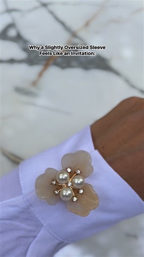 💠 The Psychology Behind It A slightly oversized sleeve — not bulky, but just too long or too wide — creates an impression of: - Ease (like you didn’t try too hard) - Softness (you’re not rigid or defensive) - Non-verbal openness (your body is “relaxed,” not guarded) It sends a subconscious message: “You’re welcome to come closer… but only if you get it.” It mimics the body language of someone who’s comfortable enough to let their guard down — but still mysterious. ⸻ 🩶 The Somatic Effect: What 