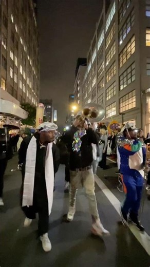 NYC musicians fill the streets of Manhattan at night. Manhattan, NYC.