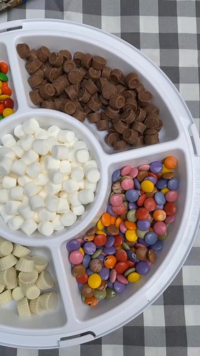 These Campfire Cones are the best for camping! Simply fill an ice cream cone with mini marshmallows, small chocolates or fruit, seal it up in some tin foil and cook over the fire until nice and melty 🥰 (Let them cool a couple minutes before passing to the kids!) | The Recipe Rebel