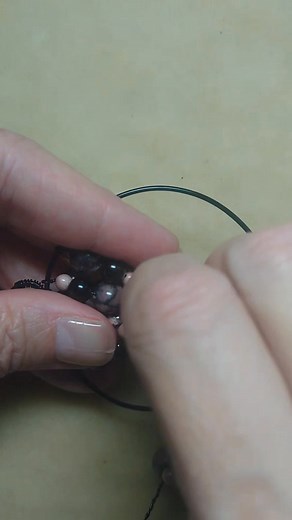 Making a tree-of-life pendant with rhodonite and obsidian beads. | Camille Sharon