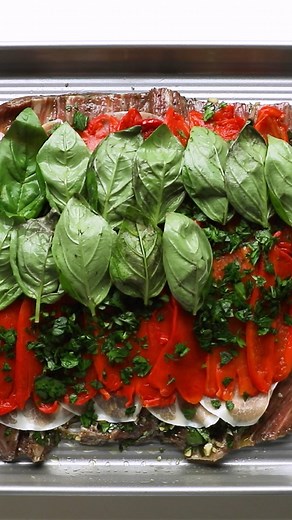 Stuff and roll a butterflied flank steak for an easy and elegant meal. Stuffed with prosciutto, basil, Parmesan, and roasted bell pepper, this stuffed flank steak recipe is a crowd-pleaser. Get the recipe: https://bit.ly/3MVuS1t | Simply Recipes