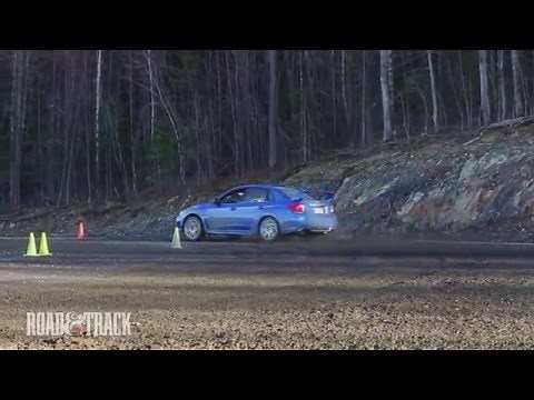 STI vs. Evo Rally Road Test | Road and Track