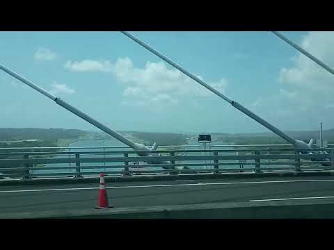 Old Panama Canal lock system on the left, new (larger) on the right