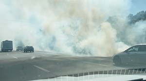 Fires slow traffic on I-49, damage at least two structures