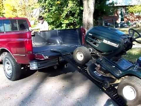 One Man EZ Load loads a riding mower onto a pickup truck