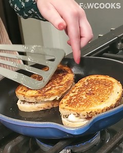 80K views · 90 reactions | Silky Taleggio and nutty Gruyère cheeses, capers, strawberry jam and a toasty turn in a hot cast-iron skillet make this Opulent Grilled Cheese recipe perfect for adding flair to a classic sandwich. Watch F&W Associate Food Editor Kelsey Youngman achieve opulence with the perfect bread-to-cheese ratio. Get the recipe here: https://bit.ly/2S59L4C | Food & Wine | Facebook