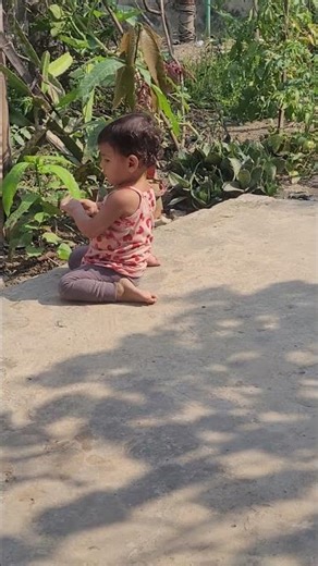 baby playing in the garden.