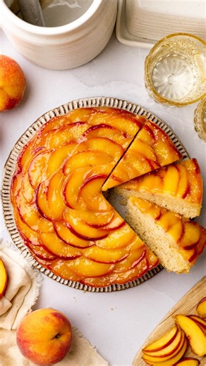 Anthea on Instagram: "This vegan peach upside-down cake is sunshine in every bite! Juicy peaches sit on top (or underneath) a light and buttery cake with the most divine crumb. It's easy to make and you don't have to fuss around with fancy decorations/frosting! Comment PEACH below and I'll DM you the recipe. Or find the recipe on my blog x https://www.rainbownourishments.com/vegan-peach-upside-down-cake/"