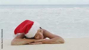Christmas beach woman wearing santa hat and bikini on holidays travel vacation getaway travel relaxing on tropical beach lying in the sand. Beautiful young female model. RED EPIC SLOW MOTION. Stock Video