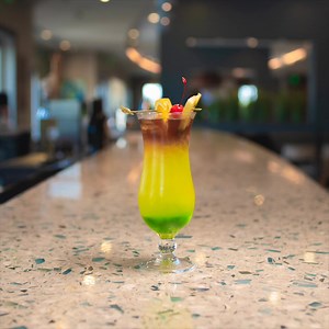 Celebrate St. Patrick's Day with one of our delicious cocktails! The Irish Monkey is a must-try made with layers of liqueur and tropical fruit juices. | Encore Resort
