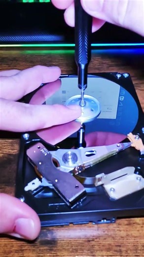 Lets take apart a hard drive and turn it on!