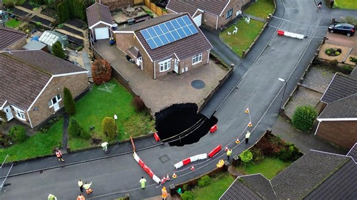 Sinkhole swallows driveway outside home