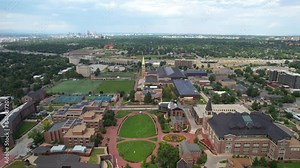 Aerial Drone Flyover of University of Denver (DU) College campus with city and neighborhood in the background - Denver , Colorado, USA