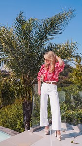 Hello, my name is Erin, and I am an outfit repeater... 💃 Yesterday, I shared this show-stopping red floral top styled with matching shorts, but I wanted to show you another really accessible way to style it with pieces you likely already have in your closet! When it comes to spring style, one of my my go-to style uniforms is white jeans, a bright spring top, and sandals. I love how in this outfit the white denim makes the floral pattern pop on the top. I just got these white jeans, and I really