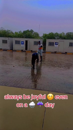 Joyful Handstand in Rainy Outdoor Setting