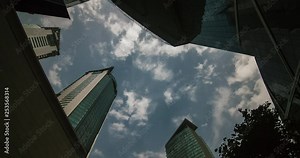 The skyline of Doha. Doha at Time-lapse, Qatar. Wide shot, Modern skyscrapers and towers with the sea at night. Tall buildings city center Time-lapse video, Middle East.