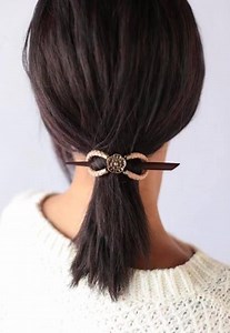 1K views · 50 reactions | Tudor Rose is unique with antiqued brass and tan colored genuine leather braided and shaped into the flagship Flexi Clip. Suggested with the natural walnut stick for a classic look. Many other hair stick styles are sold separately for a customized option. | Lilla Rose, Inc. | Facebook