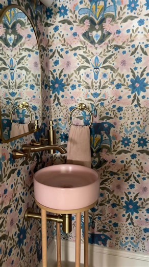 I’m so excited to give you all a first look at the my final finished powder room renovation project! Double tap this post and drop a comment below if you love this space!! 👇🩷 If you have been following along this journey, I posted where we started in episode 1 and how it was going in episode 2. Now it’s time for episode 3 and this tiny space under the stairs is complete and ready for guests!! Wallpaper from @wallpaperdirect m Pink Sink from @ConcrettiDesigns Faucets from @Delta Faucet Canada L