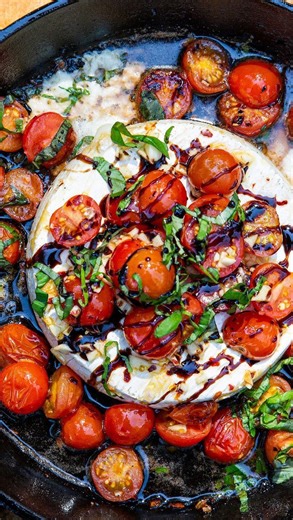 This summery brie recipe is everything you love about a Caprese salad combined with hot, bubbly cheese and smoky campfire flavors. It’s the perfect appetizer to serve at your Olympics watch party 😍 Kick off your next barbecue or campfire with this Campfire Caprese Brie skillet and it will definitely be a crowd favorite! #summer #summerrecipes #camp #campfire #brie #easyyrecipes #fire #cheese #skillet #vegetarian Recipe by Lauren Miyashiro, shot by @damian_calvo, produced by @thegarnishedpalate,