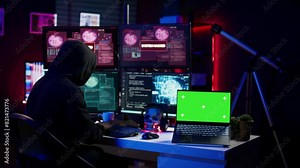 Hacker using isolated screen laptop and AI technology to deploy malware on unsecured devices. Scammer stealing sensitive data from unaware users using mockup notebook, camera B