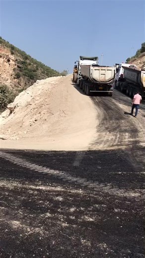 Heavy-Duty Dump Trucks in Action on Construction Site
