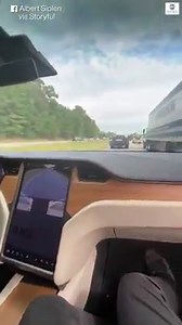 LOOK MA, NO HANDS: New owner of Tesla Model X relaxes in the passenger seat as the high-tech vehicle seemingly drives itself down a North Carolina highway. "Current Autopilot features require active driver supervision," the company says. | News 5 Cleveland