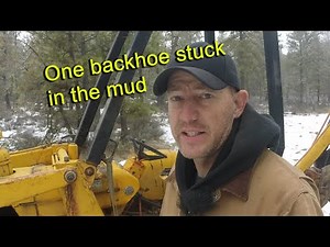 Recovery of a backhoe stuck in the mud