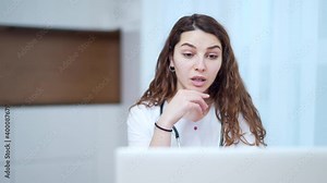 Woman doctor talking to client using virtual chat computer app. Female medical assistant wears white coat, video calling distant patient on laptop. Telemedicine, online remote healthcare services