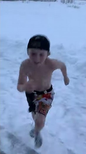 Boy Wearing Only Shorts Dives Into Snow in Nova Scotia