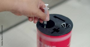 Dispose of syringes in an infectious waste container.Remove the needle from the syringe.