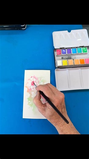 Create a sweet WATERCOLOUR CARD FRONT USING A FLORAL STENCIL! Use any watercolour paints you might have on hand. Even a small child’s set will do. IMPORTANT NOTE: Use a heavy weight WATERCOLOUR PAPER. 300g is perfect because you will be using a fair bit of water. SPRITZ YOUR STENCIL WITH WATER and lay your watercolours! Flip the stencil over, coloured side down onto the paper and gently press down with a paper towel to transfer the image. Lift the stencil then go in with the colours you used her