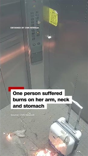 Surveillance video shows gas-filled balloons exploding in an elevator
