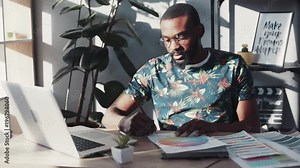 Stylish man african american use laptop work with documents write sit sunlight room design house technology successful male black online young pc workplace businessman tech graphic tablet portrait