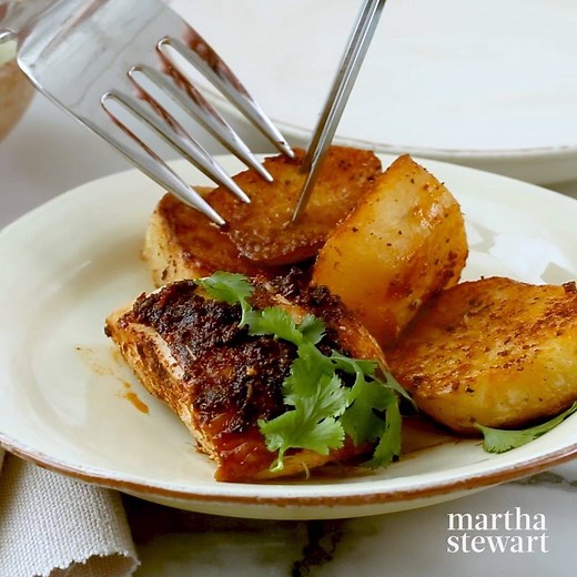 Fair warning: It will be hard determine if your favorite part of this dish is the fragrant spice-rubbed chicken, the crispy potatoes, or the bright and creamy green sauce. But you're in luck—you don't have to choose! All three components work in perfect harmony for this company-worthy winner of a chicken dinner. https://trib.al/86UxiEz | Martha Stewart
