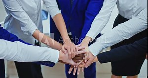 Close-up, group of businessmen stands in a circle and puts their hand on hand, team unity. Teamwork concept. 4k, ProRes