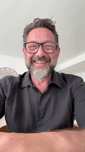 One man alone at home using phone camera to enjoy a videocall with friend online. Talking and having fun on video call people. Dating mature male. Using smartphone to call parents, during travel