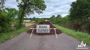 Excessive rainfall in Blanchard, Oklahoma has caused a local reservoir to overflow and destroy County Road 1322, leaving multiple residents stranded without access in or out. The damage left behind includes a 40-foot-wide crater where the road once stood. County officials are now working urgently to find a way to restore access to the area, but for now, the stranded residents remain cut off. #Oklahoma #Blanchard #flooding #drone #stormchasing | Storm Chaser Jordan Hall