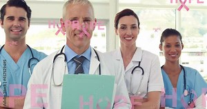 Animation of hope text with pink ribbon logos, floating over smiling male and female doctors Stock Video