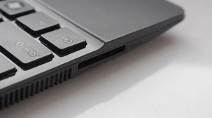 clip-12950468-inserting-removing-sd-card-laptop-flat-picture